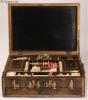 SB498: An early 19th Century  fully fitted Chinese export lacquer combined sewing and writing box of rectangular form opening to a fully fitted sewing tray with turned and carved ivory tools and having a drawer fitted for writing. Circa 1800.   