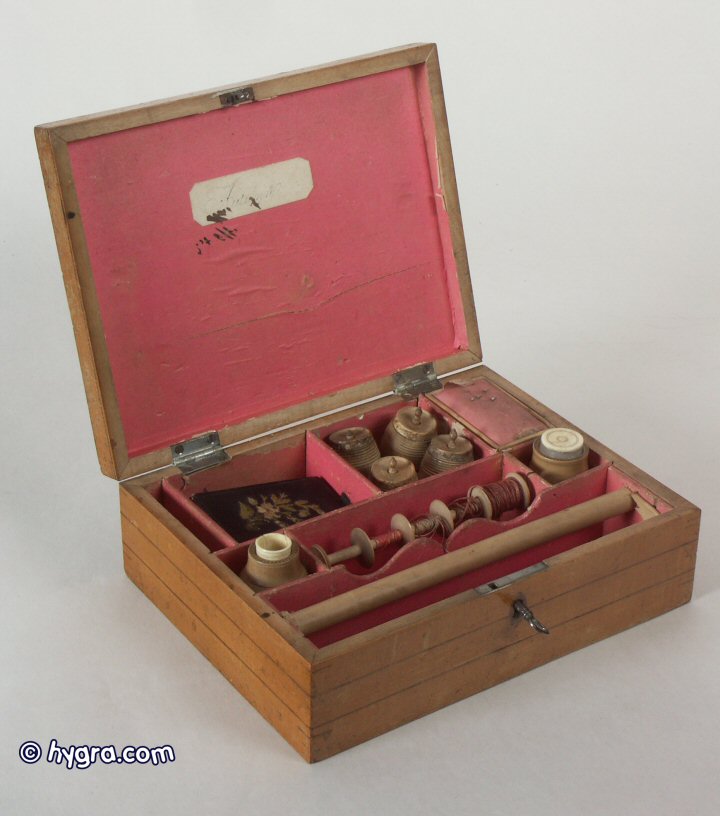  Sb 107: Rare late 18th century inlaid maple fitted sewing box decorated with a hand colored print depicting Autumn and having original turned wooden tools and thread barrels. 